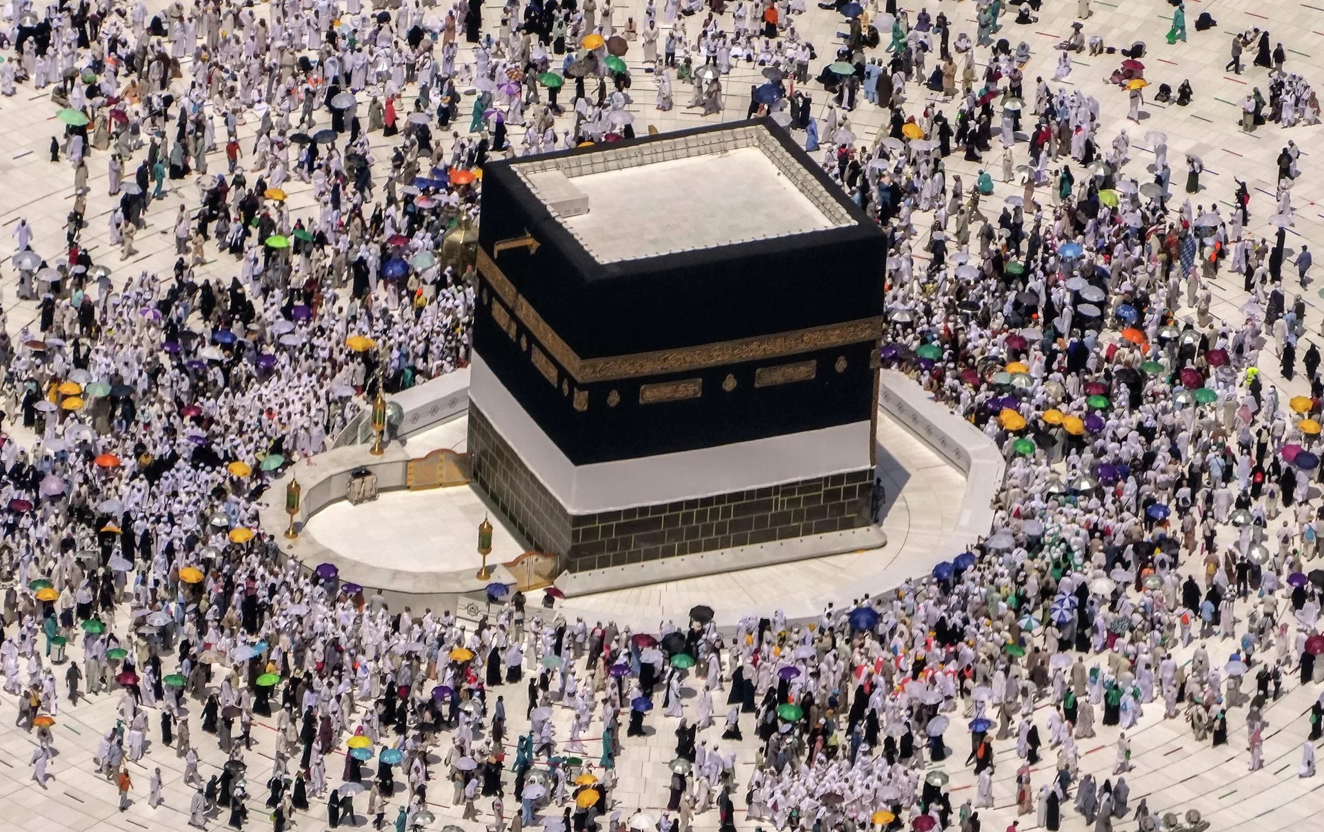 Muslim pilgrims walk around the Kaaba, the cubic building at the Grand Mosque, during the annual hajj pilgrimage to Mecca, Saudi Arabia - Sputnik India, 1920, 24.10.2023